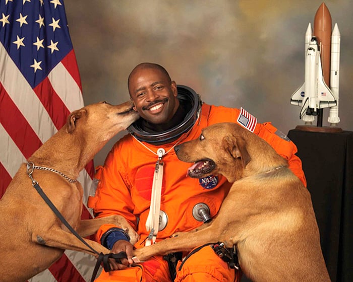 NASA astronaut Leland D Melvin with his dogs Jake and Scout