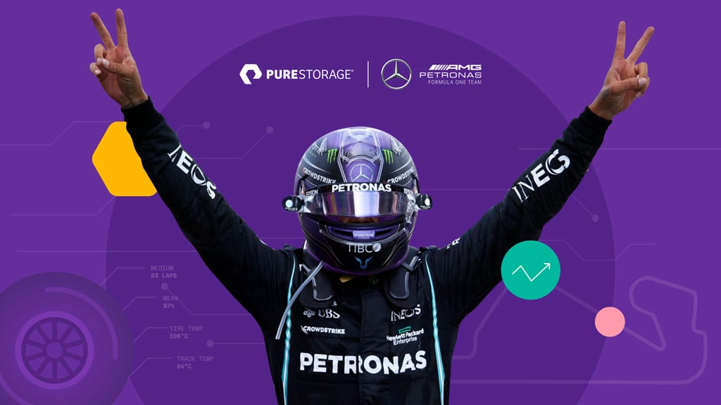 Lewis Hamilton next to PureStorage Designed by Smithographic Logo & Brand Identity Designer Studio, used by the F1 Mercedes AMG Petronas Team